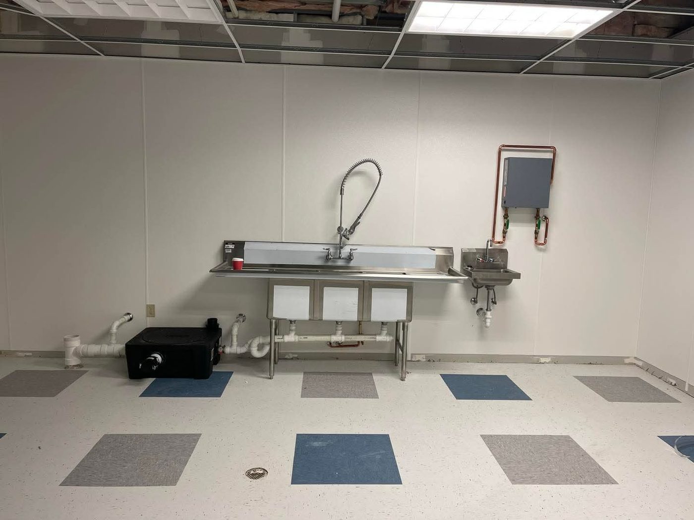 Commercial three-bay sink installation